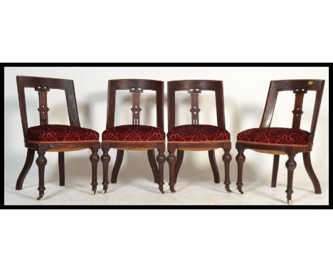 A set of four 19th century Victorian Aesthetic movement mahogany dining chairs on ceramic castors with turned&nbsp; reeded le