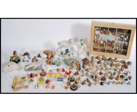 A collection of small ceramic figurines to include Wade Whimsies to include two tortoise figurines, pig, fawn, beaver dog and