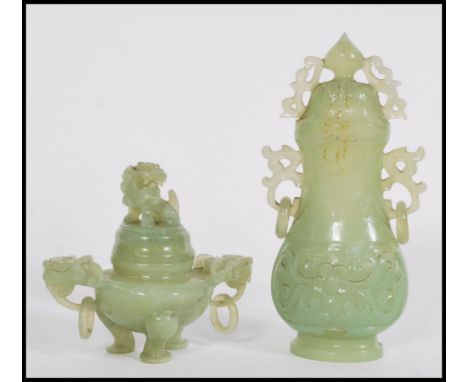 An early 20th century Chinese jade lidded vase having scrolled decoration and Devils work hoop handles along with a jade Cens