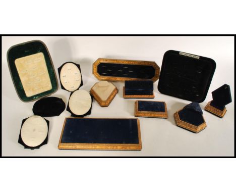 A selection of shop jewellery display units including a ring tray, necklace display, and counter plinths having walnut and gi