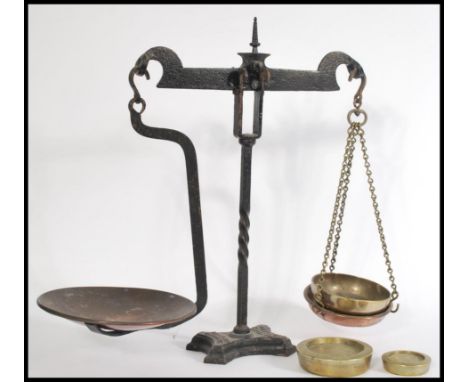A set of Bartlett Bristol brass &amp; cast iron shop scales, with two Parnall &amp; Sons Ltd. brass weights of 1lbs and 4lbs.