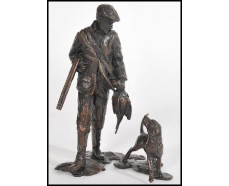 A bronze figure of a pheasant hunter with a hound and gun by Michael Simpson, stamped MS to the base, limited edition number 