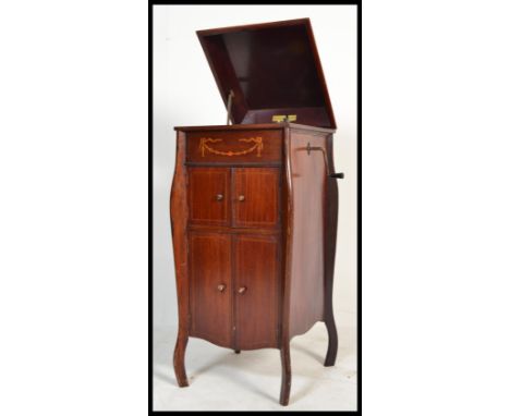 An early 20th century Fullotone floor standing gramophone with hinged lid to the cabinet and box wood swag inlay. Raised on s