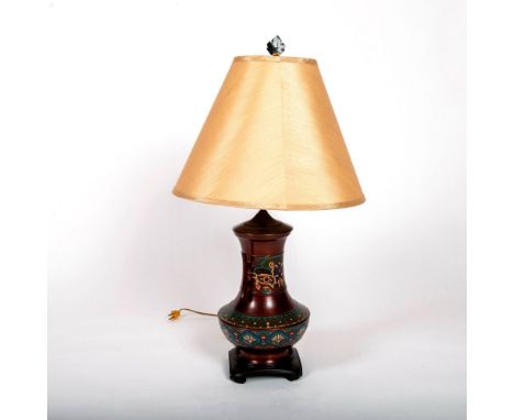 A brass enamel lamp with a floral decor. Lamp shade included. Dimensions: 17"W x 29.5"HCondition: Age related wear. Not teste