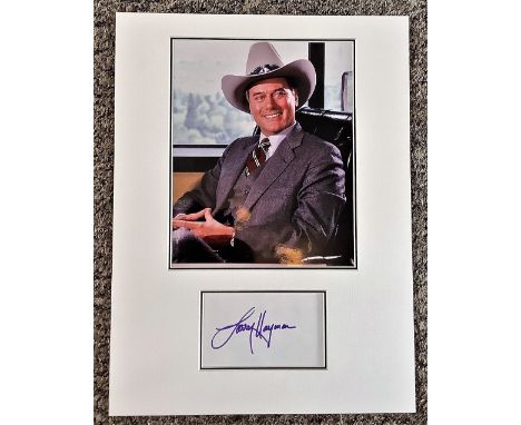 Larry Hagman 16x12 approx mounted signature piece includes signed album page and a colour photo pictured in his role as JR Ew
