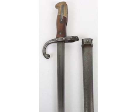 French Gras Bayonet, with wooden and brass mounts to the hilt. Steel cross guard and muzzle ring. Housed in its steel scabbar