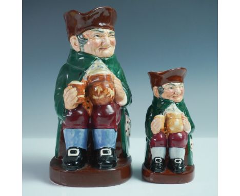 This pair of Royal Doulton Old Charley Toby Jugs represents the classic English night watchman. The large jug (D6030), design