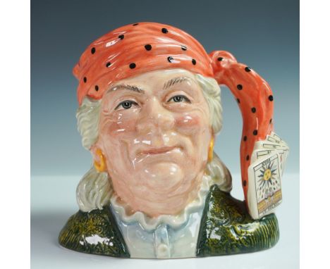 this hand-made and hand-decorated ceramic jug features a detailed depiction of a fortune teller, complete with a vibrant oran
