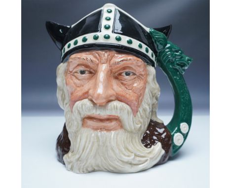 This Royal Doulton character jug, model D6496, titled Viking, showcases a striking hand-painted ceramic design with intricate