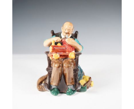 A Royal Doulton The Toymaker HN2250 figurine, designed by Leslie Harradine, depicting an elderly craftsman seated in a wooden