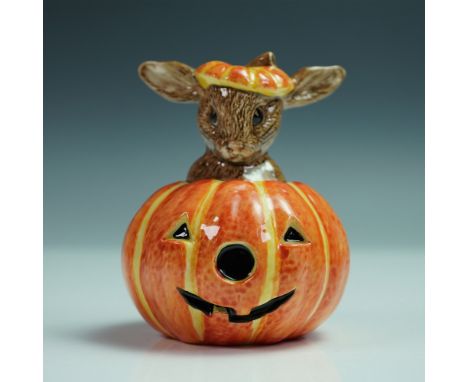 This hand-painted figurine features a Bunnykins character playfully peeking out from a carved jack-o'-lantern, wearing a matc