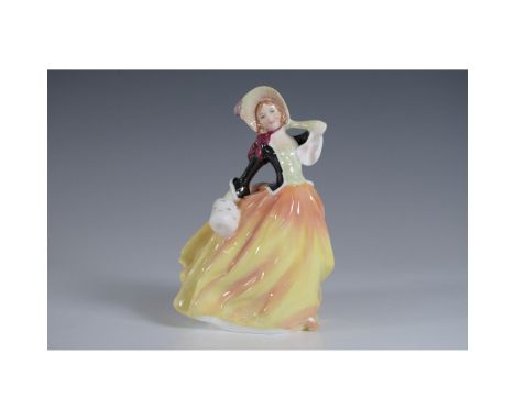 Royal Doulton figurine titled Autumn Breeze, model HN2131. This elegant hand-painted porcelain figure depicts a graceful woma
