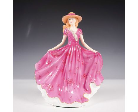The Royal Doulton Elizabeth Figure of the Year 2014 (HN 5671) is a finely crafted bone china figurine designed by Neil Faulkn