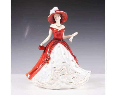 This hand-decorated bone china figurine showcases a graceful woman elegantly dressed in a striking red and white gown with go