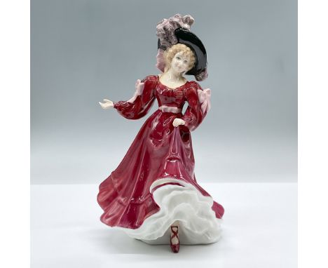 Featuring a woman dressed in red with a black and pink hat. This special edition figure of the year was only available in 199