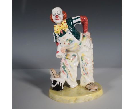 A whimsical Coalport fine bone china figurine titled Auguste's Mishap from the Cavalcade of Clowns series. This lively piece 