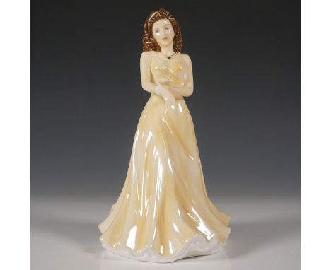 This exquisite Royal Doulton Birthstones June Pearl figurine (HN5631) is crafted from hand-decorated bone china. Released as 