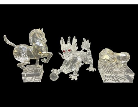 Two Swarovski Crystal Signs of the Zodiac figures, comprising horse and tiger, together with Zodiac dragon holding the flamin