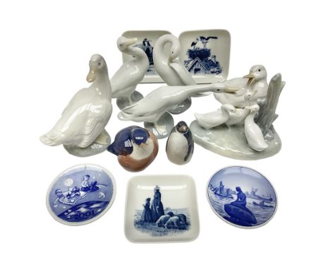 Two Royal Copenhagen figures, comprising robin and penguin, together Royal Copenhagen trinket dishes and Nao and Lladro figur