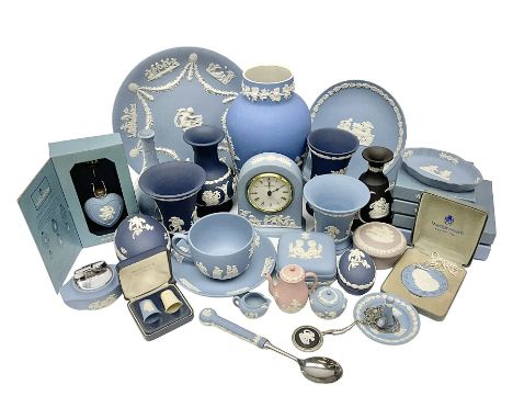 Large collection of Wedgwood Jasperware in dark blue, lilac and light blue, to include mantle clock, lidded boxes, vases, pla