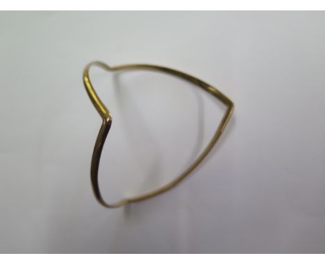 A 9ct yellow gold triangular bangle marked 9ct SB &amp; SLD, total weight approx 26 grams, some usage marks but generally goo