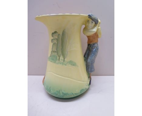 A Burleigh ware pottery jug, the handle moulded with a golfer, printed mark to base, 19.5cm high, minor wear to painted decor