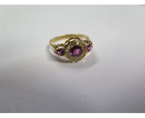 A pretty hallmarked 18ct yellow gold diamond and ruby ring, size O, approx 2.6 grams, central stone approx 4.5mm x 2.5mm, in 