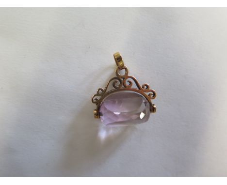 A yellow gold amethyst fob, 25mm wide, tests to approx 18ct, approx 10.3 grams 