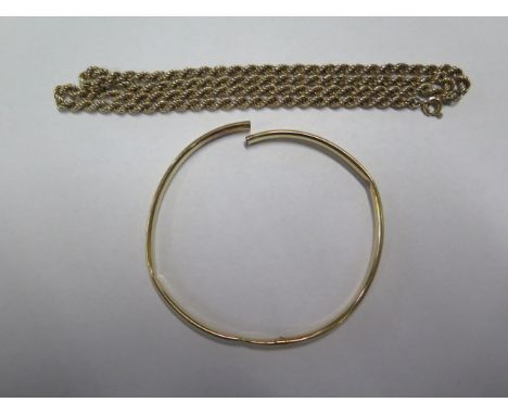 A hallmarked 9ct yellow gold chain, 47cm long, clasp working, generally good and a broken gold bangle tests to approx 9ct, to