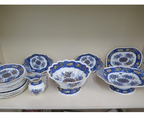 A 19th century spode 'Trophy' pattern part dinner service, foliate decorated with a yellow and blue wide border comprising: a