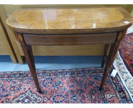 A Regency inlaid mahogany fold over card table, 74cm tall x 91cm, 44cm when closed 