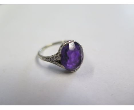 A platinum amethyst ring, amethyst approx 11.5mm x 10mm x 6mm, set with small diamonds to the shoulders, size N, approx 3.4 g