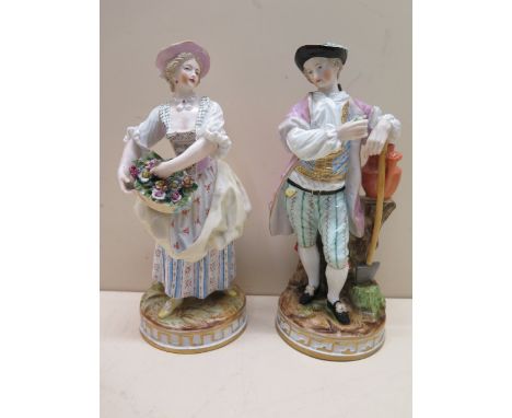 A pair of continental porcelain figures, early 20th century, modelled as gallant and flower seller companion, blue mark to ba