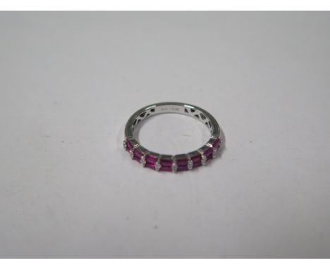 An 18ct white gold diamond and ruby 17 stone diamond ring, marked 750, ring size M, approx 2.8gs, in good condition 