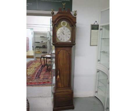 A good mahogany 8 day striking longcase clock with a silvered brass 12" arched dial, signed William Markes Warminster, stand 