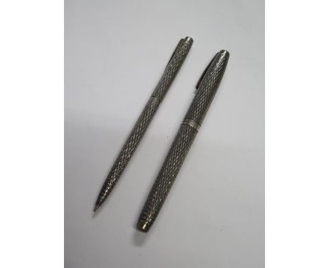 A silver Sheaffer fountain pen and ballpoint pen set, both generally good, some tarnishing, ballpoint working 