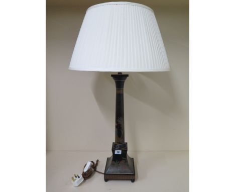 A painted table lamp with a shade, 75cm tall 