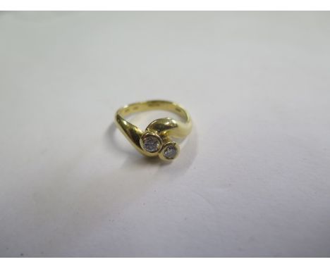 A hallmarked 18ct yellow gold diamond crossover ring, diamonds approx 0.20ct each, size K, approx 4.9 grams 