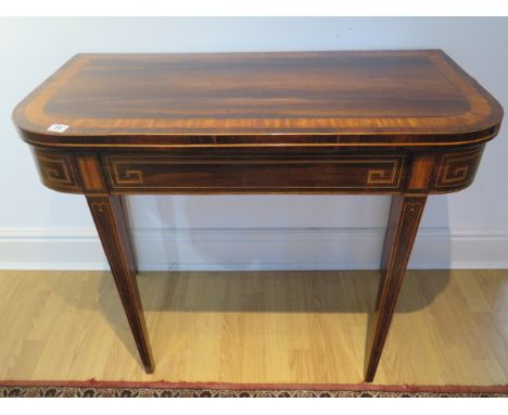 A Regency rosewood inlaid fold over card table in restored condition, 74cm tall x 92cm wide, 45cm when closed 