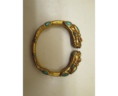A turquoise and agate gilt bangle, 8cm x 7cm, in good condition 
