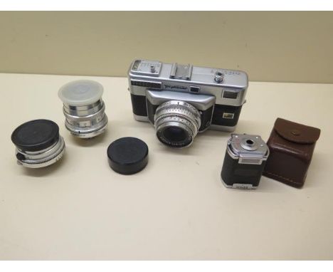 A Voigtlander Vitessa T Rangefinder 35mm camera complete with 35mm,50mm,100mm lenses and a Turnit multifocal viewfinder. All 