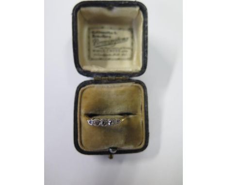 A yellow gold five stone diamond ring, no hallmarks but tests to approx 18ct, size R, approx 2.3 grams, some usage wear but d