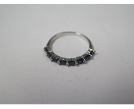 An 18ct white gold blue sapphire and diamond 17 stone ring marked 750, size N, approx 2gs, in good condition with invoice dat