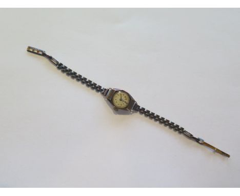 A 9ct yellow gold ladies manual wind wristwatch, strap marked 9ct, not running, approx 11 grams 