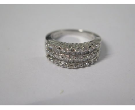 A 14ct white gold five band diamond ring, consisting of brilliant cut and princess cut diamonds, size N/O, total weight stamp