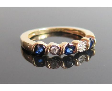 A 14K Gold Sapphire and Diamond Five Stone Ring, size M.5