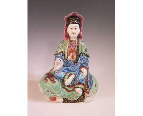 A Chinese Pottery Seated Figure of Guan Yin, 20 cm
