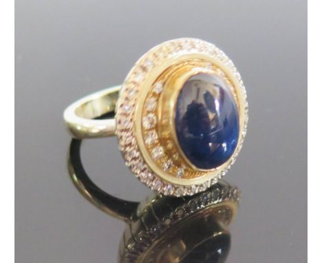 A Cabochon Sapphire and Diamond Dress Ring by Capello in 18ct yellow gold mount, sapphire 10.27ct, size N, 17.6g