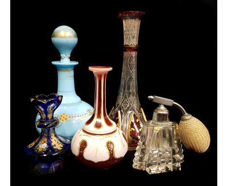 A French turquoise glass perfume bottle and stopper; three Bohemian perfume bottles cased in cobalt blue and ruby, 18.5cm max