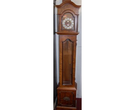 A reproduction Continental figured walnut grandmother clock, having glazed trunk door, three train movement with pendulum and